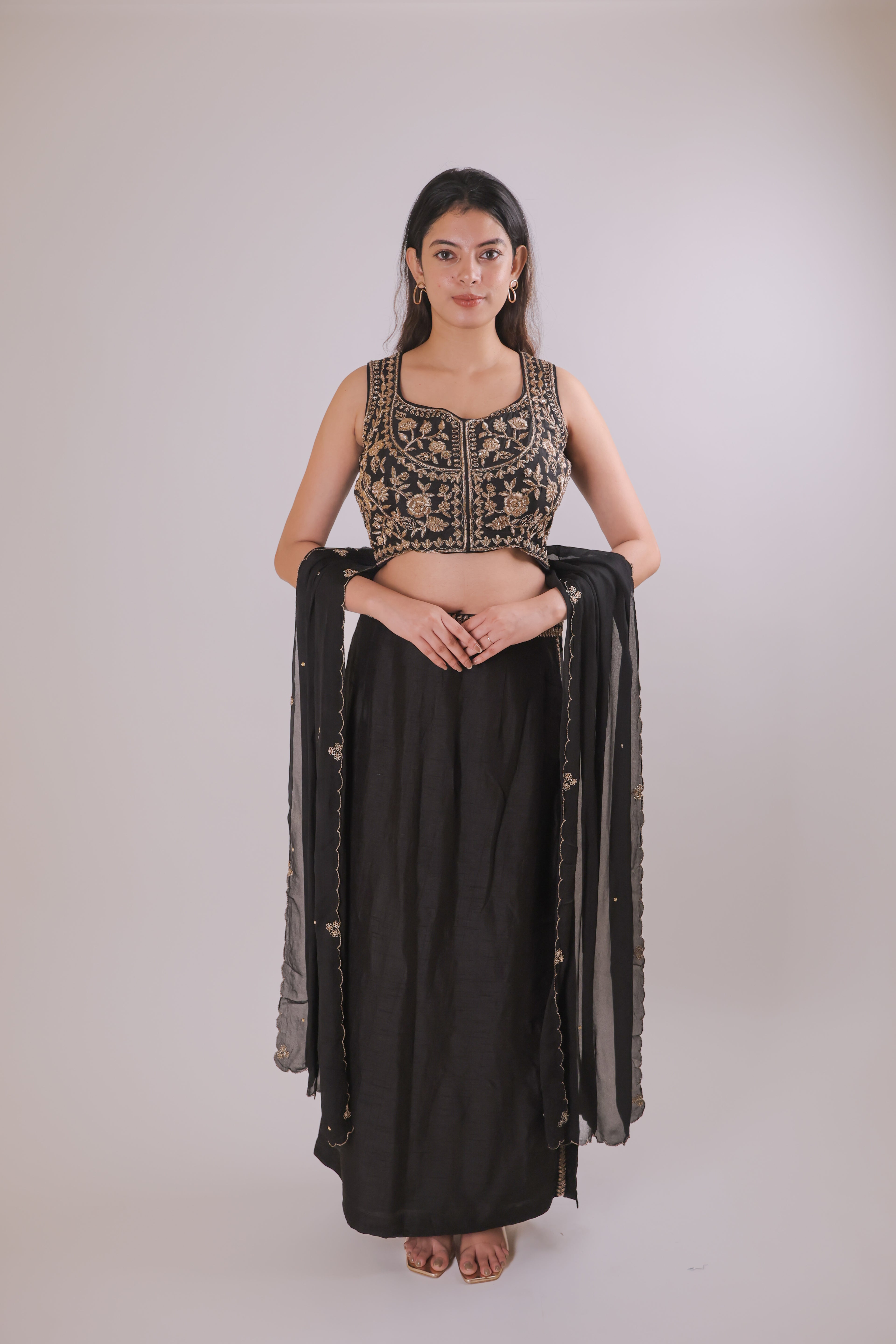 Black sleeveless top with straight skirt