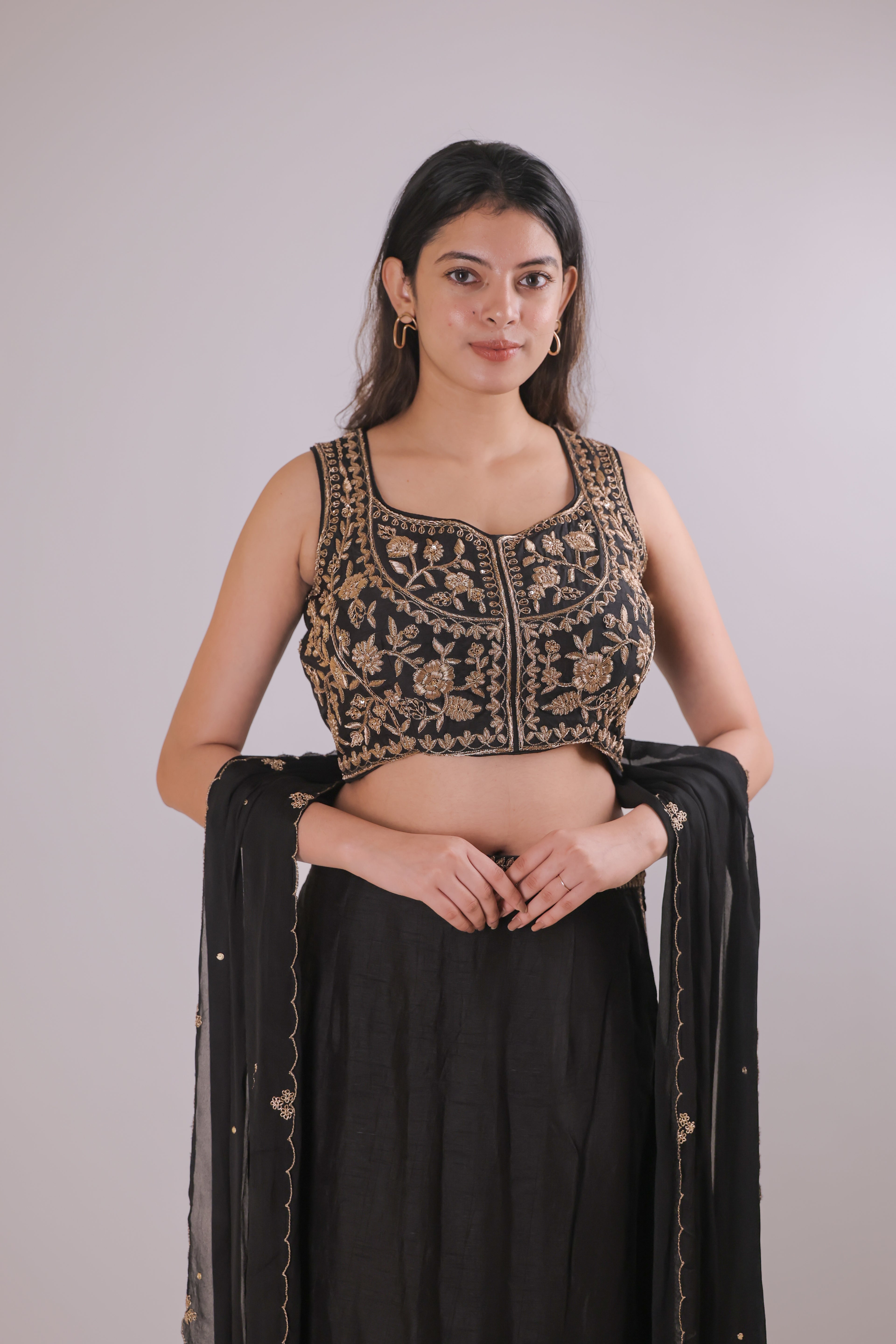 Black sleeveless top with straight skirt