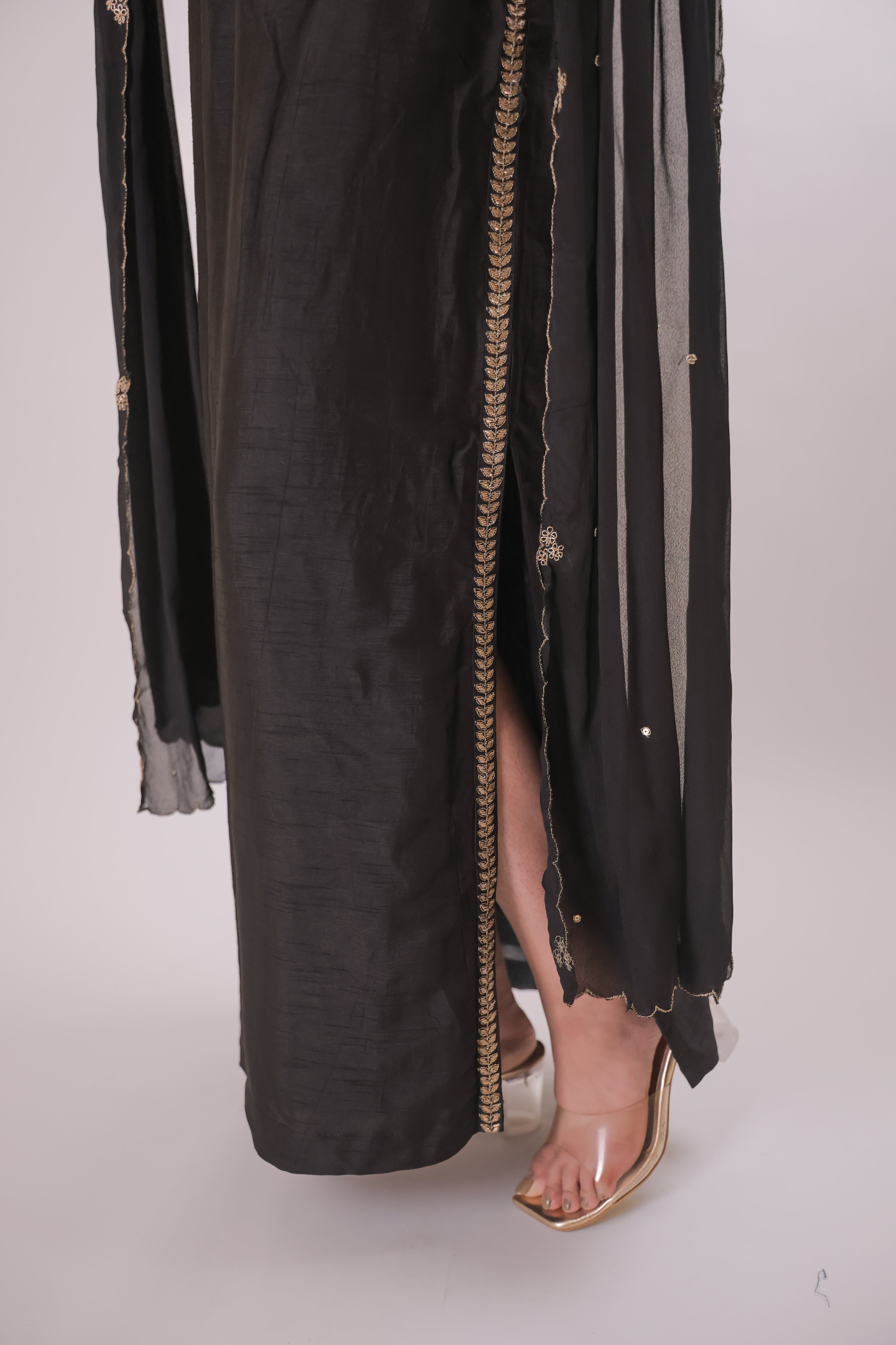 Black sleeveless top with straight skirt