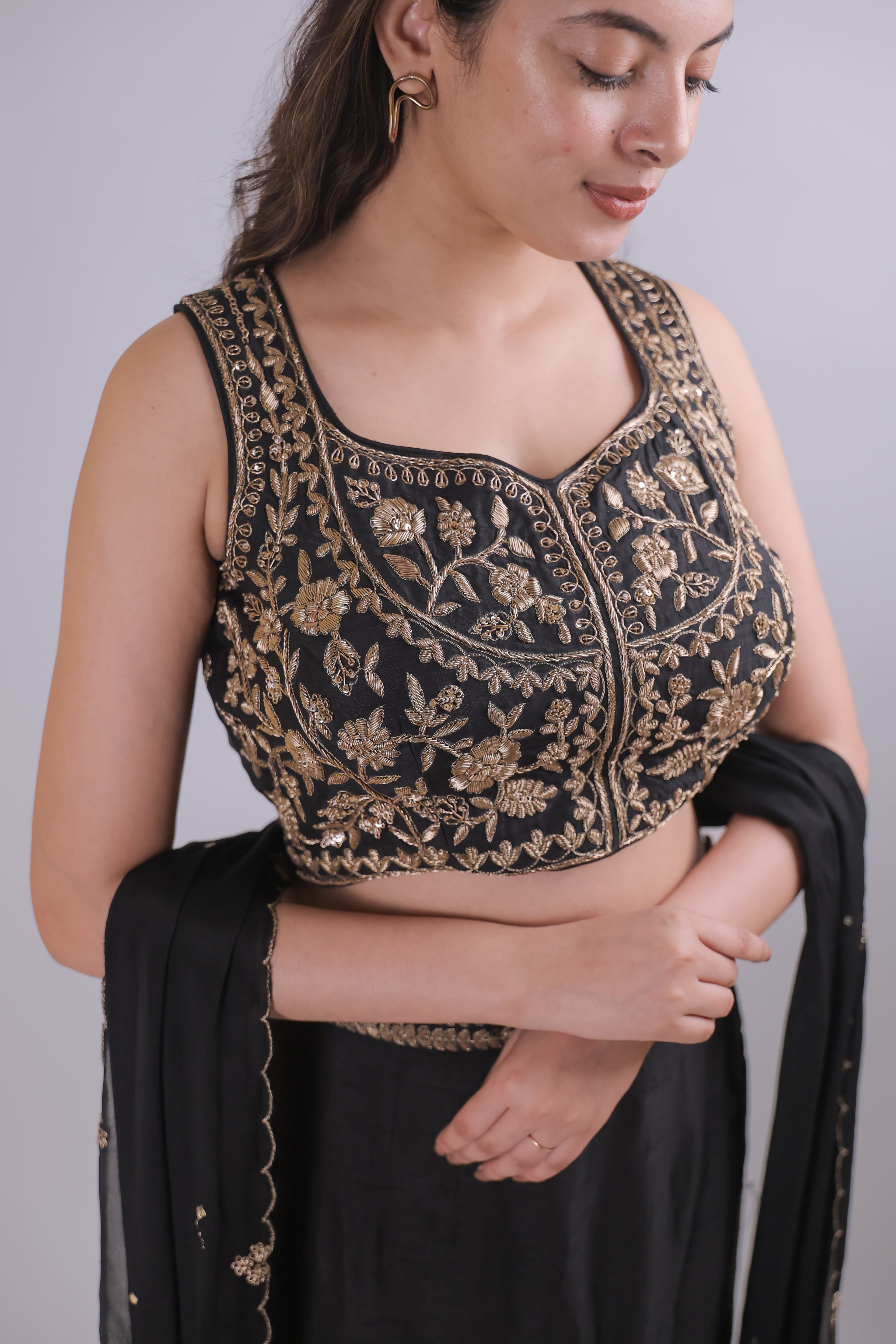 Black sleeveless top with straight skirt