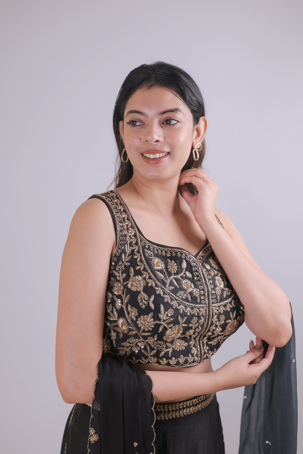 Black sleeveless top with straight skirt