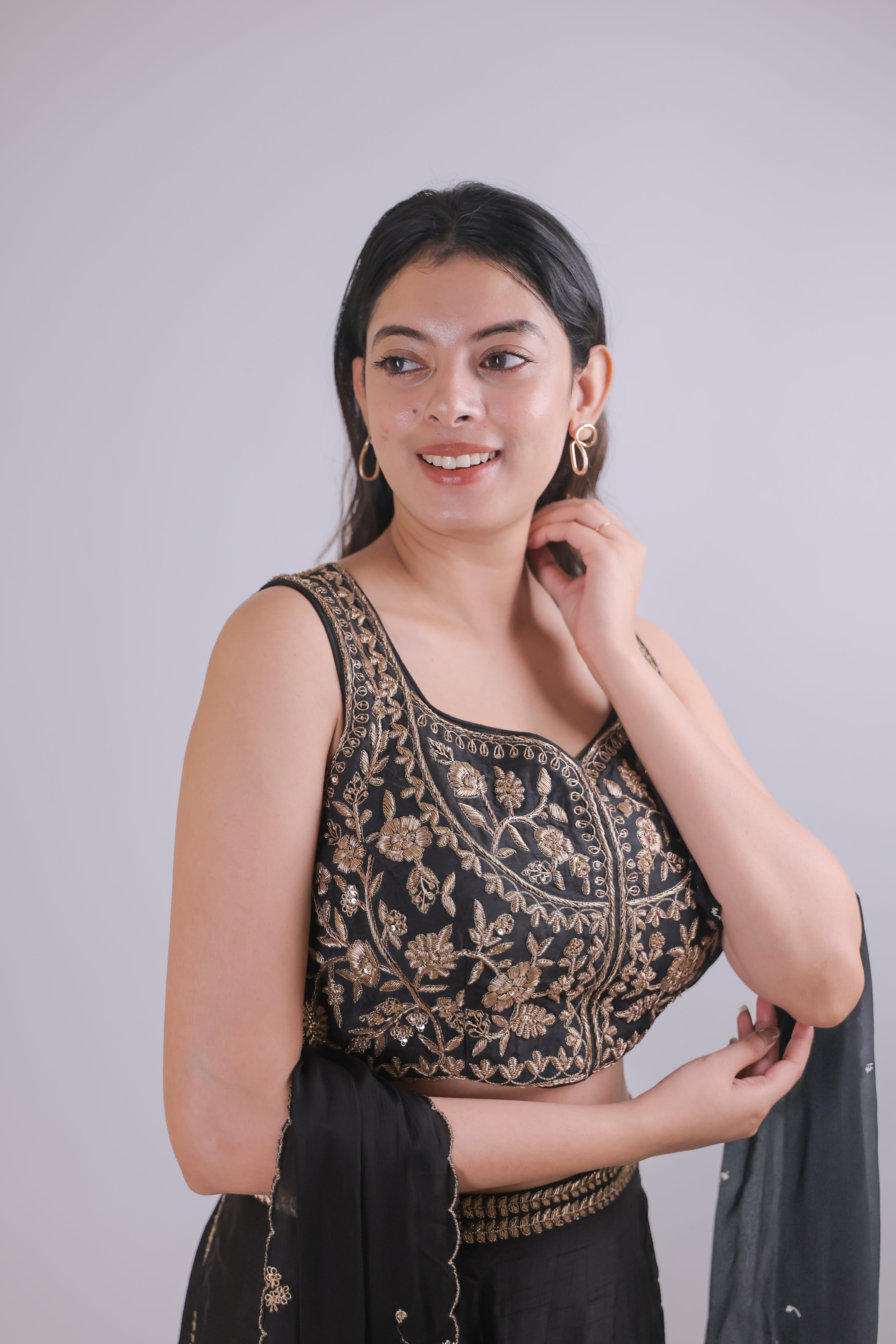 Black sleeveless top with straight skirt